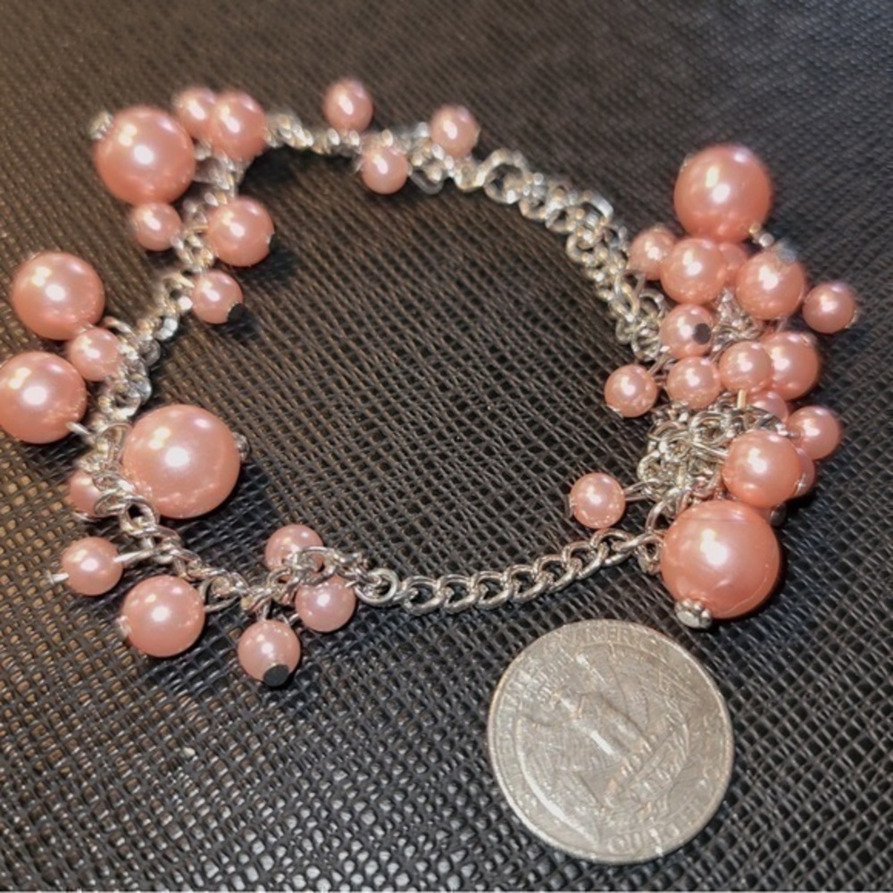 Silver tone and pink bauble bracelet